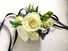 wrist corsage white rose freesia dark blue by North Shore florist